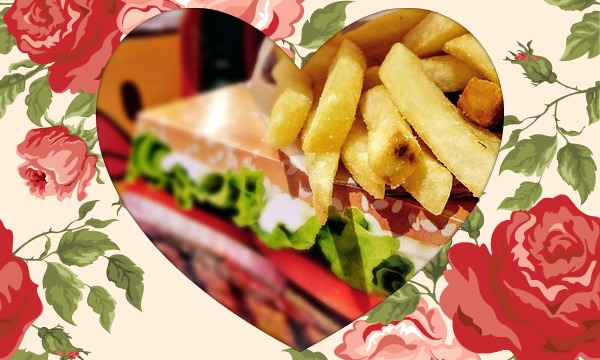 a fast food dinner with french fries and a sandwich