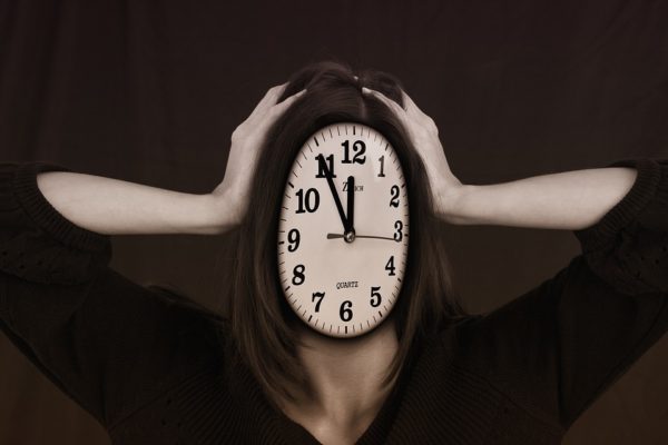 woman with a clock face