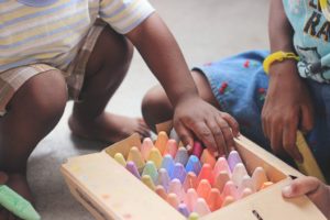 children playing with chalk during a play date