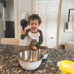 Getting ready to bake a sugar cookie recipe, boy, baking
