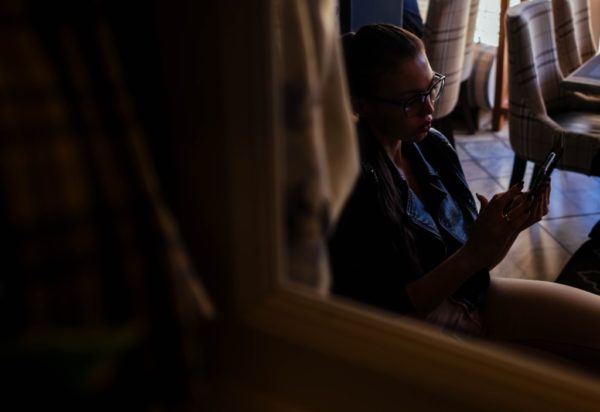 Mom Guilt: The Rabbit Hole, Balance, and Attempts to Combat It mom feeling mom guilt while looking at her phone
