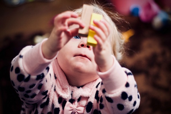 toddler with blocks during early intervention session