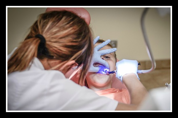 child receiving dental work, dentist