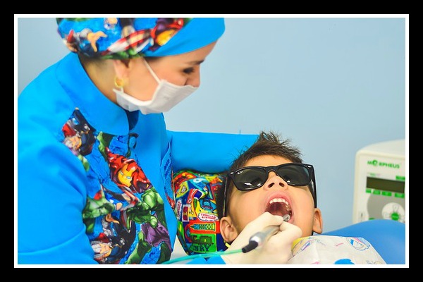 boy receiving dental work, dentist