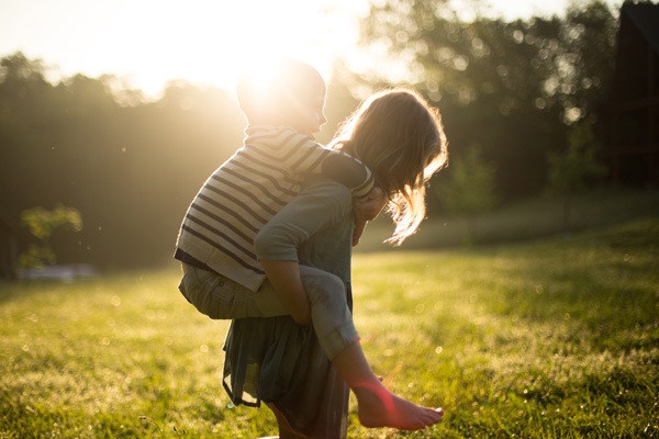 mother, son, piggyback, field, sunlight, family, fun, play