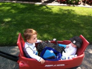 boy in red wagon