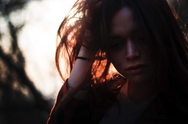 motherhood challenges, woman, tired, depressed, backlit