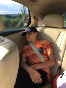 boy asleep in the car