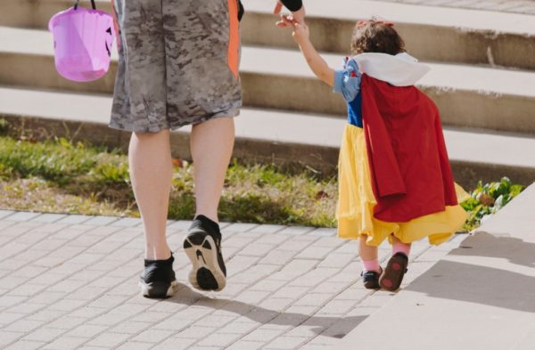 parent trick or treating with child