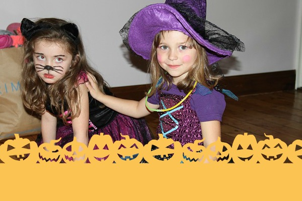 two girls in witch costumes