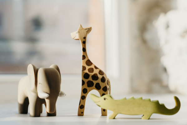 wooden elephant, giraffe and crocodile toys