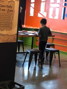 boy at standing desk