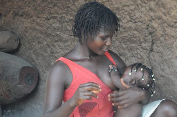 woman breastfeeding a baby