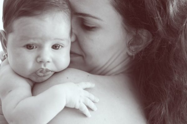 Postpartum Body – What New Moms Should Expect mom holding a baby