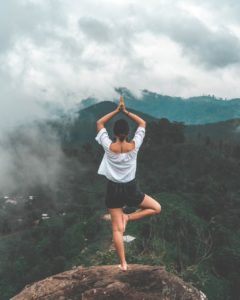 woman doing yoga in the wilderness
