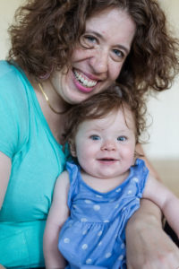Woman and baby, both smiling