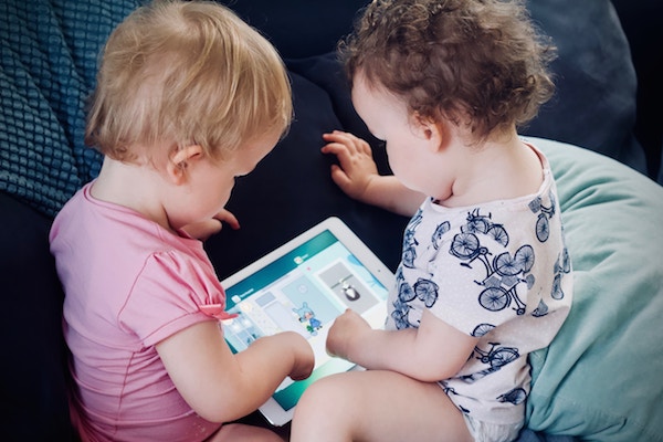 Screen Time Limits for Kids and How I Chose To Introduce Television Toddlers staring at a digital device