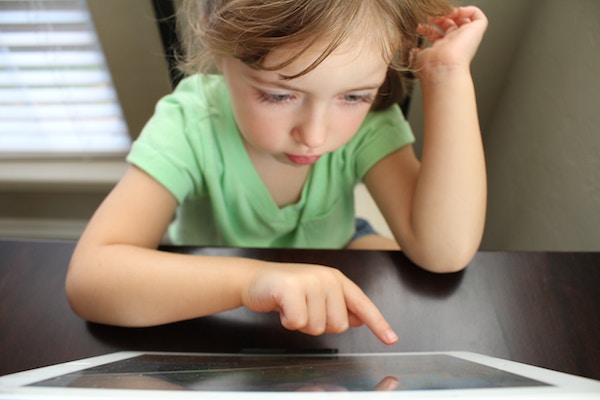 Young child staring at a screen