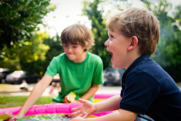 Speech Development in Children: Information From an SLP Mom boys excitedly playing