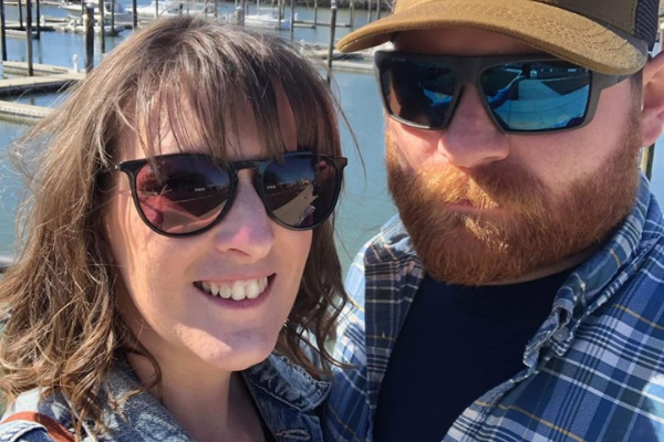 man with beard and sunglasses, woman with sunglasses
