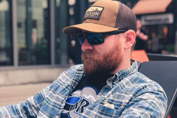 likable husband, man with red beard and a baseball hat