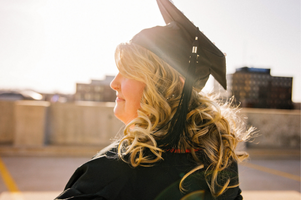 student debt, college degree, woman graduating