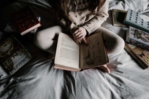 figure cross legged reading
