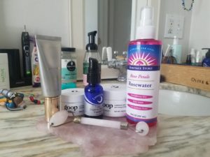 skin care products by a sink