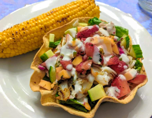 Taco bowl filled with fish and a strawberry mango salsa