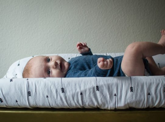 happy baby on changing table