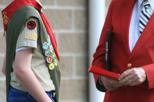boy scout talking with leader