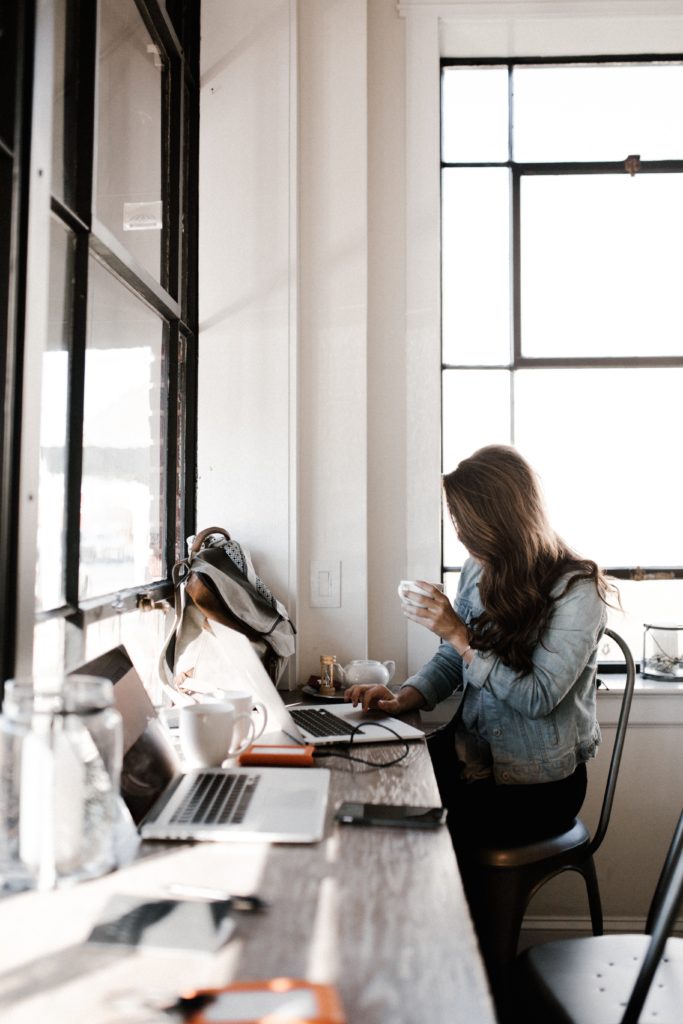 woman on the computer in a coffee shop