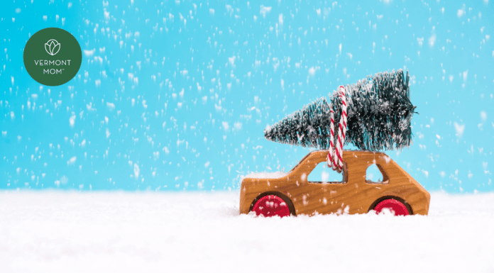 toy christmas tree on a toy car in the snow