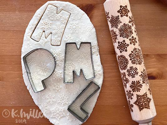 Cookie cutters stamped into salt dough.