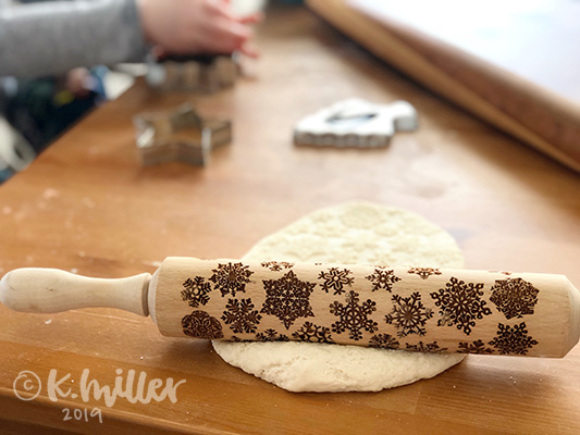 A stamped rolling pin in salt dough
