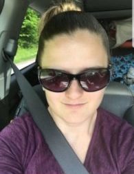 woman in sunglasses in a minivan