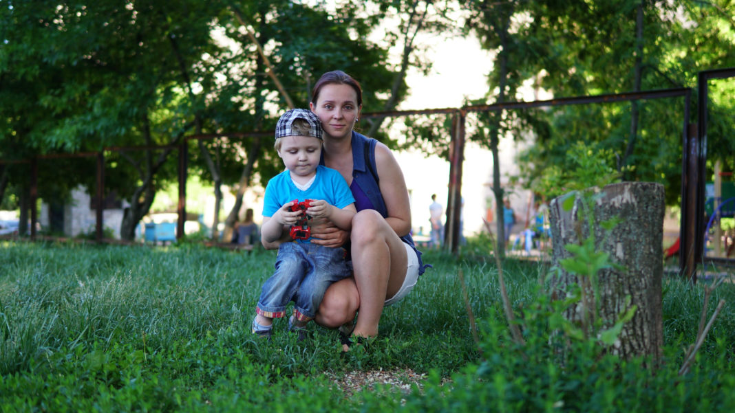 A Day that Left Me Shaken, Defeated, and Questioning My Parenting mother holds son