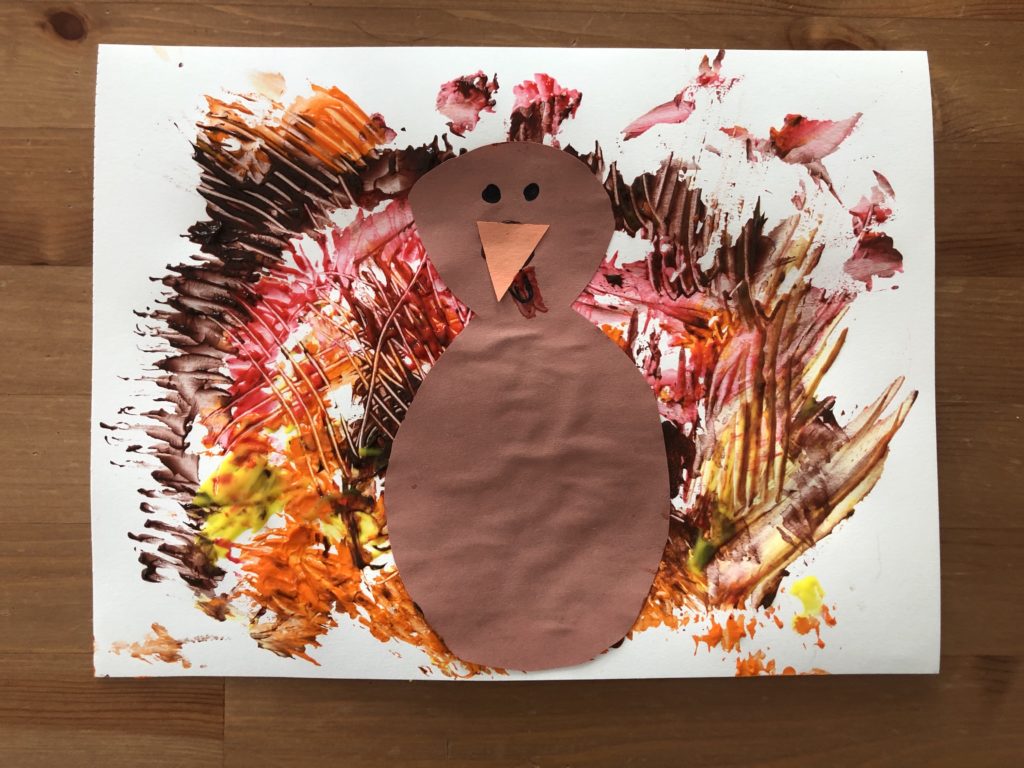 A finished child’s art project, a painting of a turkey.