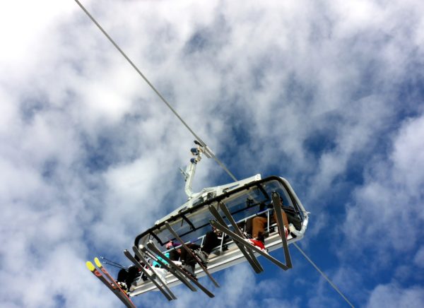 family on a ski lift in winter gear