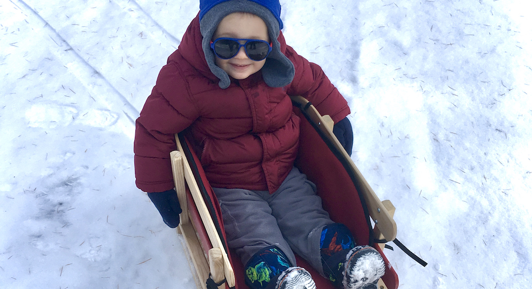Family-Friendly Weekend Events in Vermont this February child sledding in winter