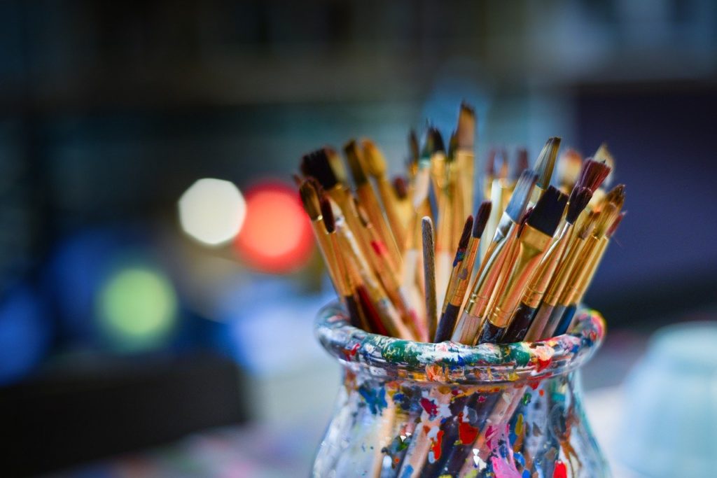 Paintbrushes in a glass jar from Inclusive Arts, a Vermont Charity