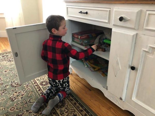 Liam cleans the livingroom as part of our chore for money system