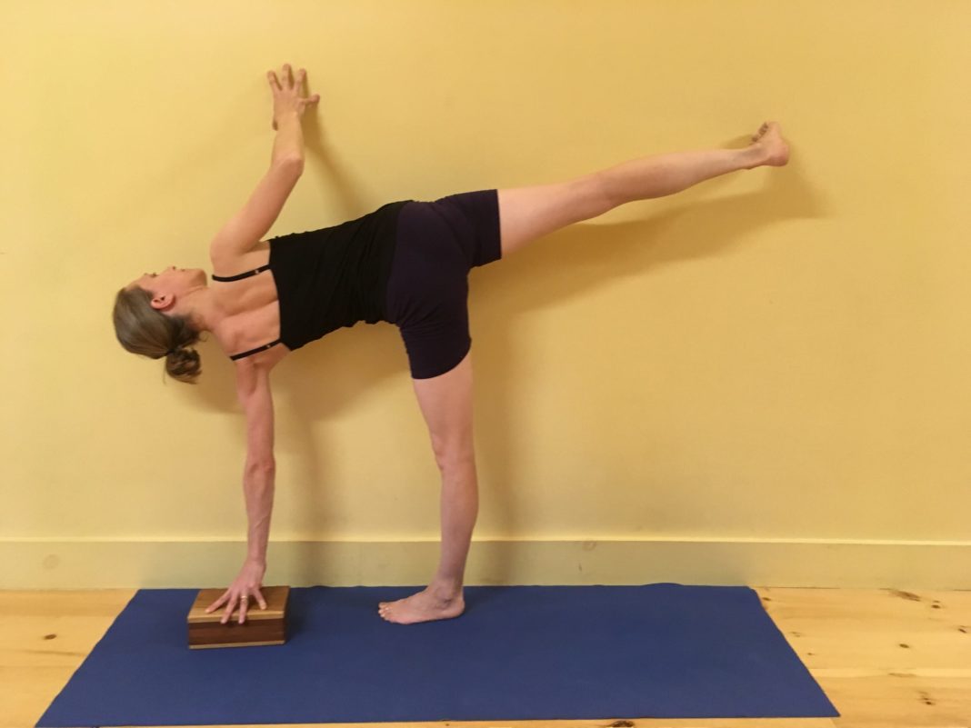 Iyengar Yoga Postpartum and Pelvic Floor Class: One Mom’s Experience using a block to support a yoga pose