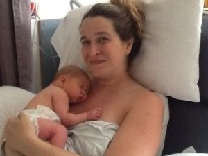 mother holding newborn