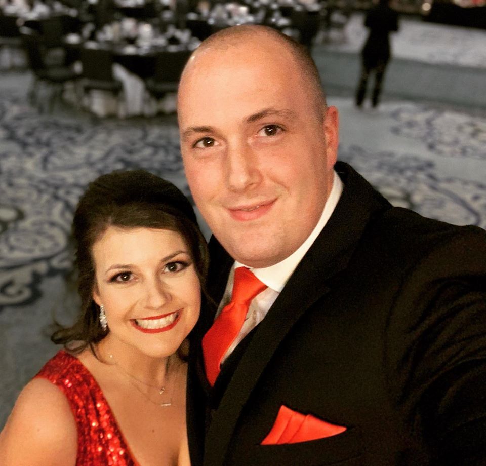 husband and wife, dressed formally