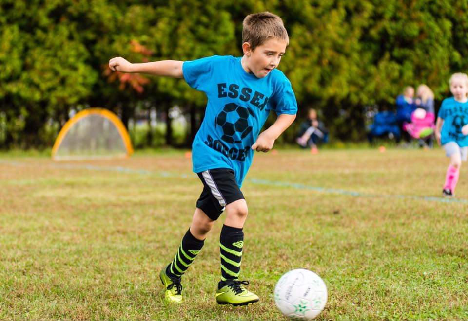boy playing soccer