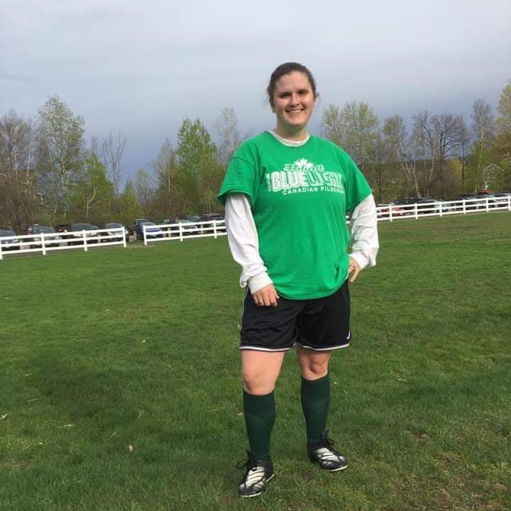 soccer (playing) mom, poses after her first game.