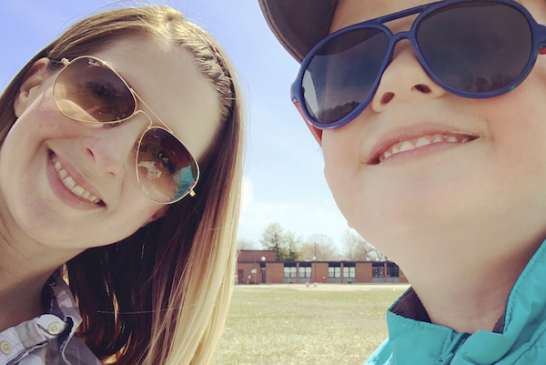 Mom and son posing for picture while on vacation