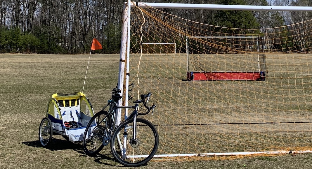 Bike with trailer on a field