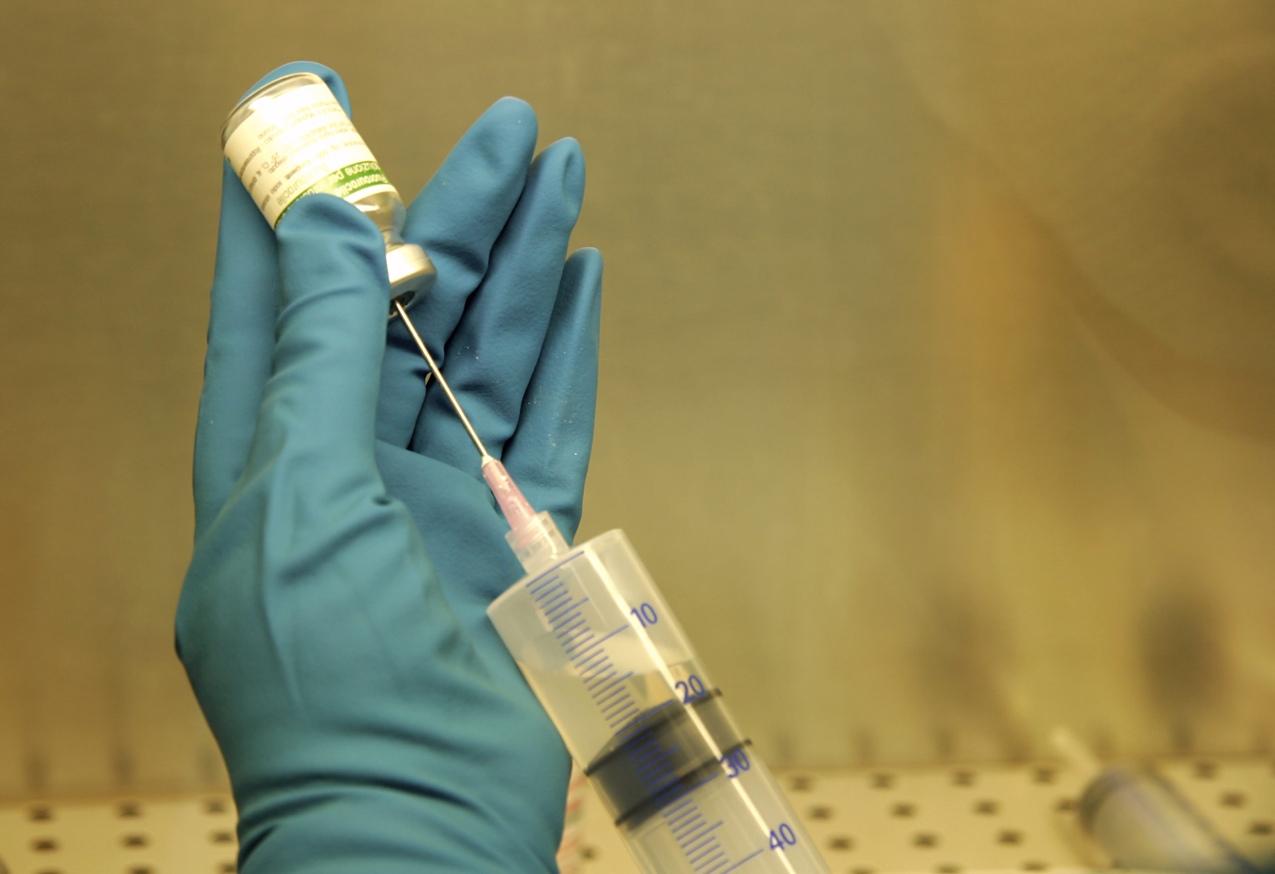 nurse holding syringe